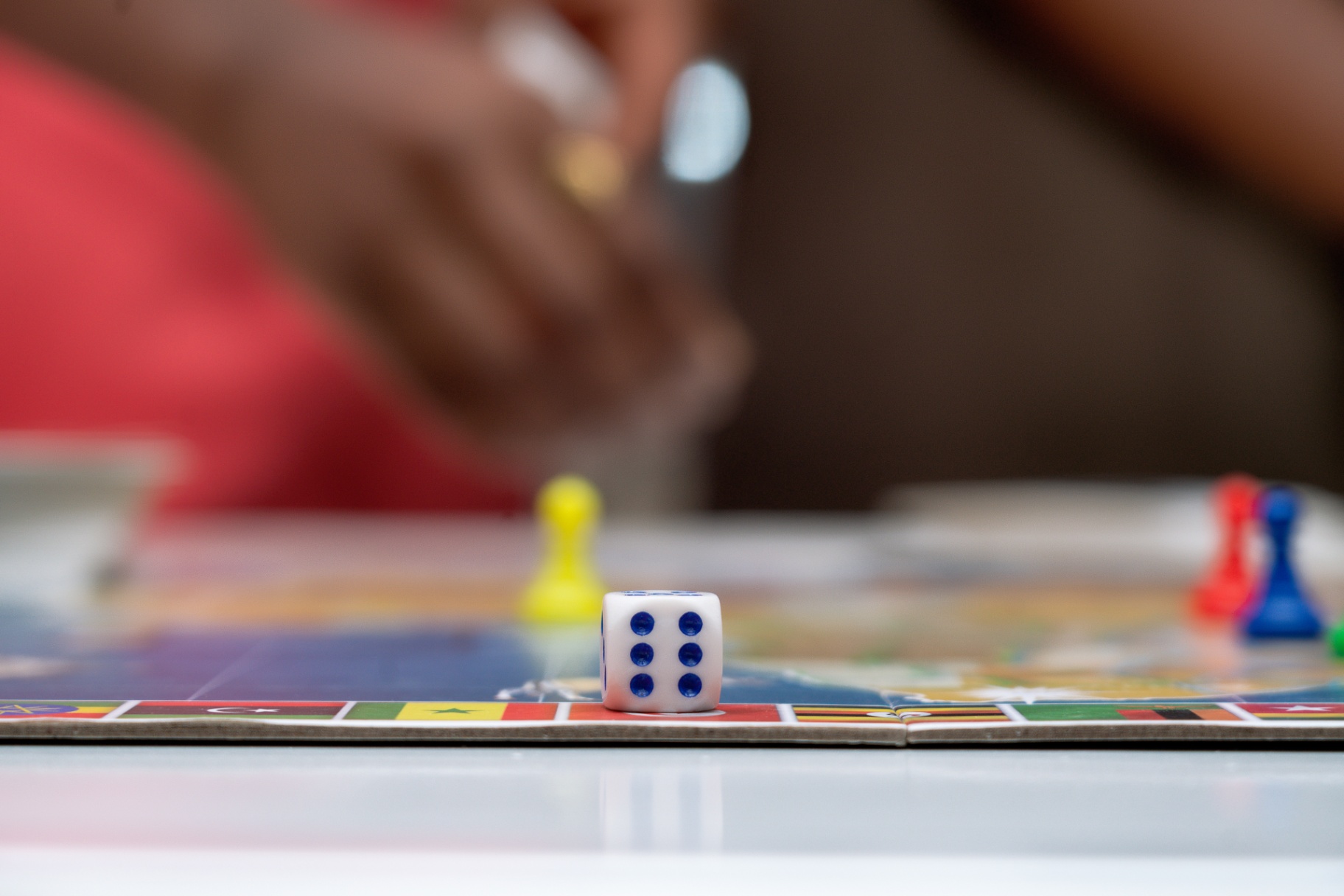 Close-up of dice and pawns mid-game